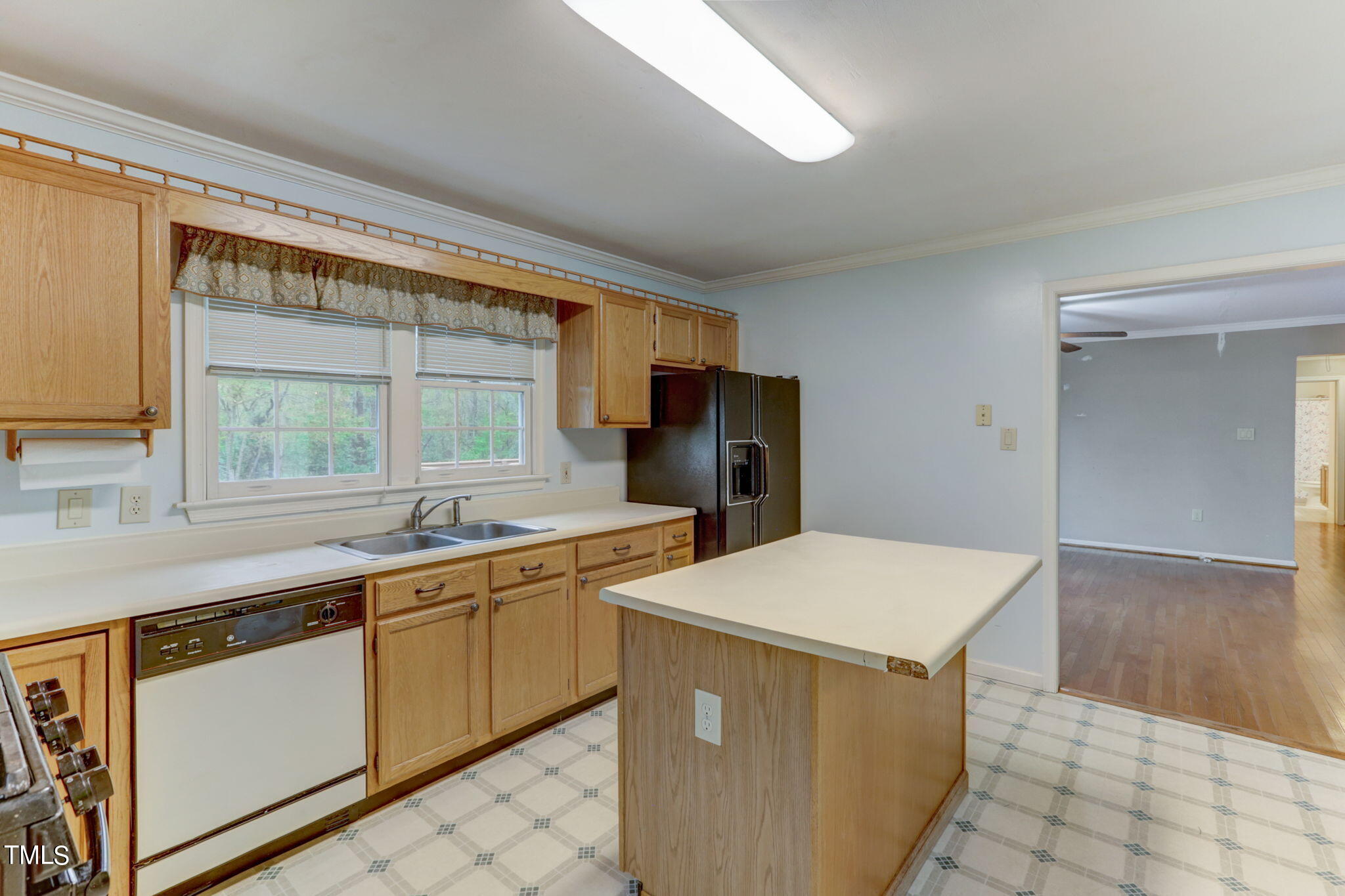 193 Lily Lane Road Roxboro, NC 27574 - Photo 14 of 45 a kitchen that has a sink a stove and a refrigerator