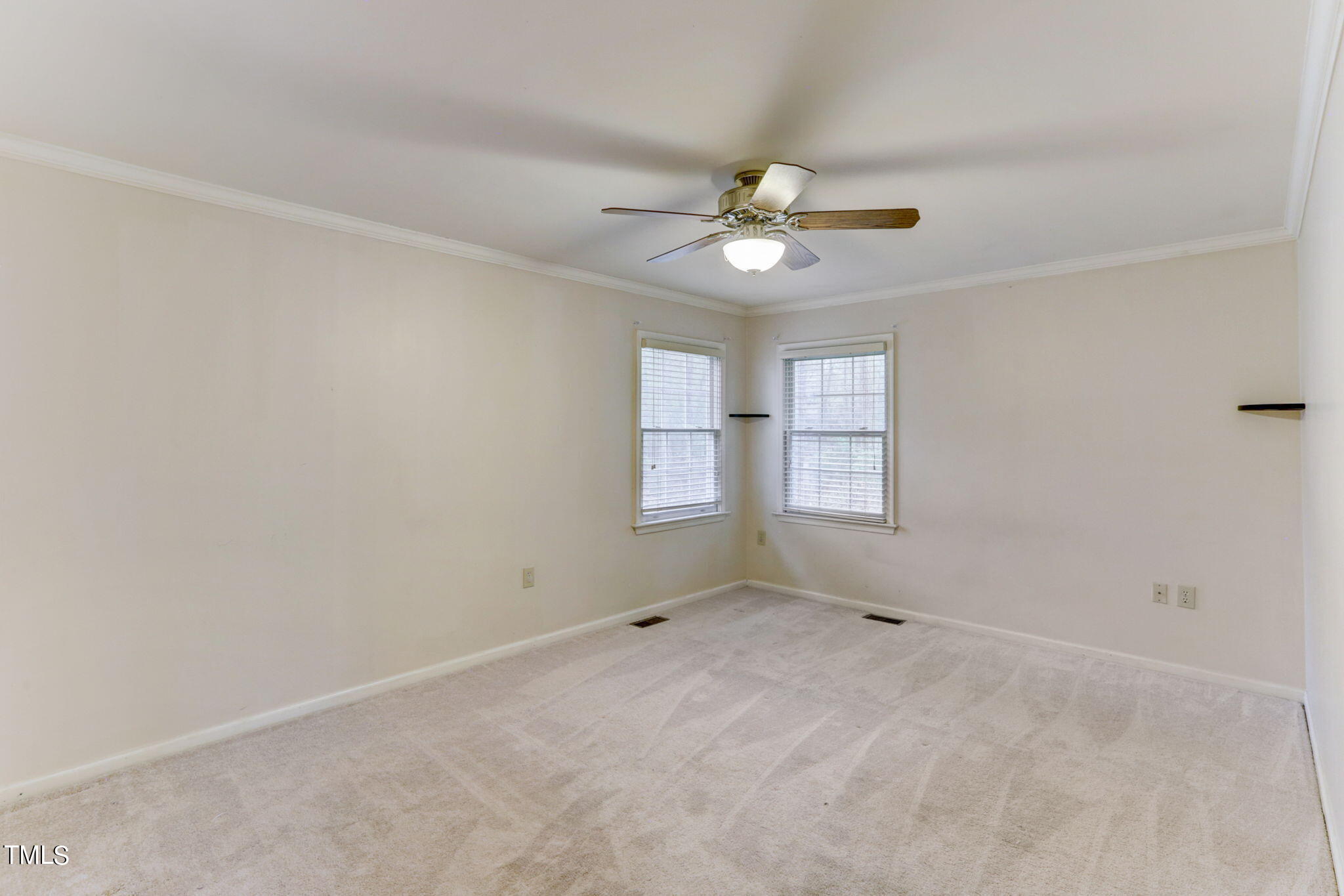 193 Lily Lane Road Roxboro, NC 27574 - Photo 18 of 45 an empty room with windows and fan