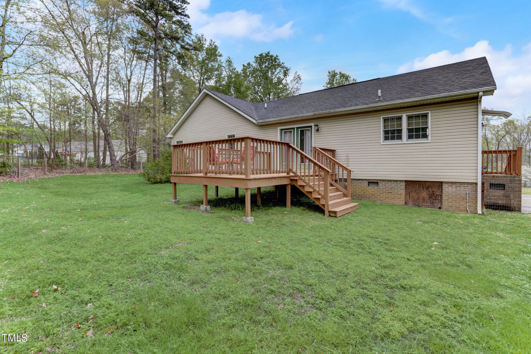 193 Lily Lane Road Roxboro, NC 27574 - Photo 30 of 45 a view of a house with a big yard and large trees