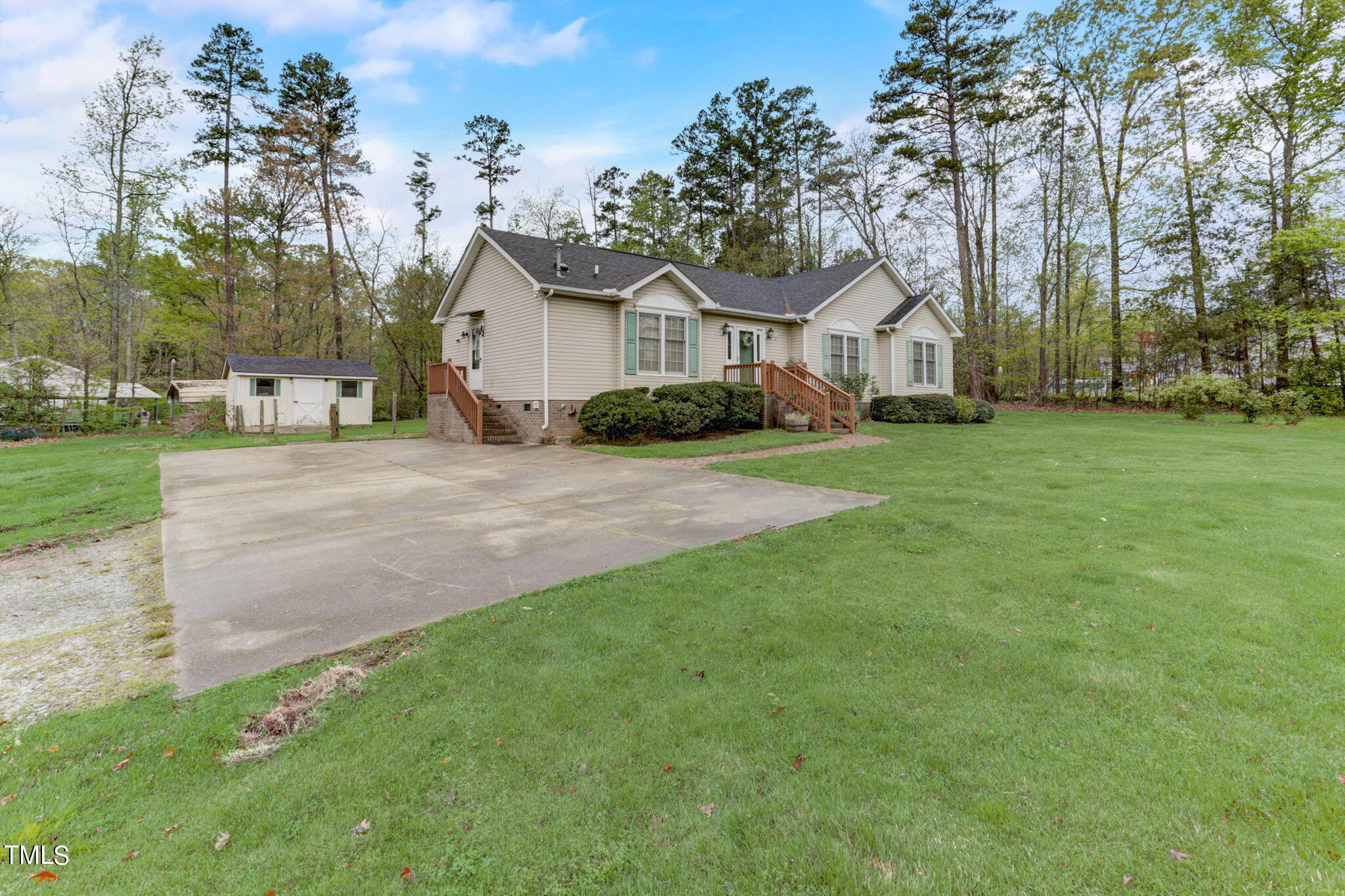 193 Lily Lane Road Roxboro, NC 27574 - Photo 3 of 45 a front view of a house with a yard and trees