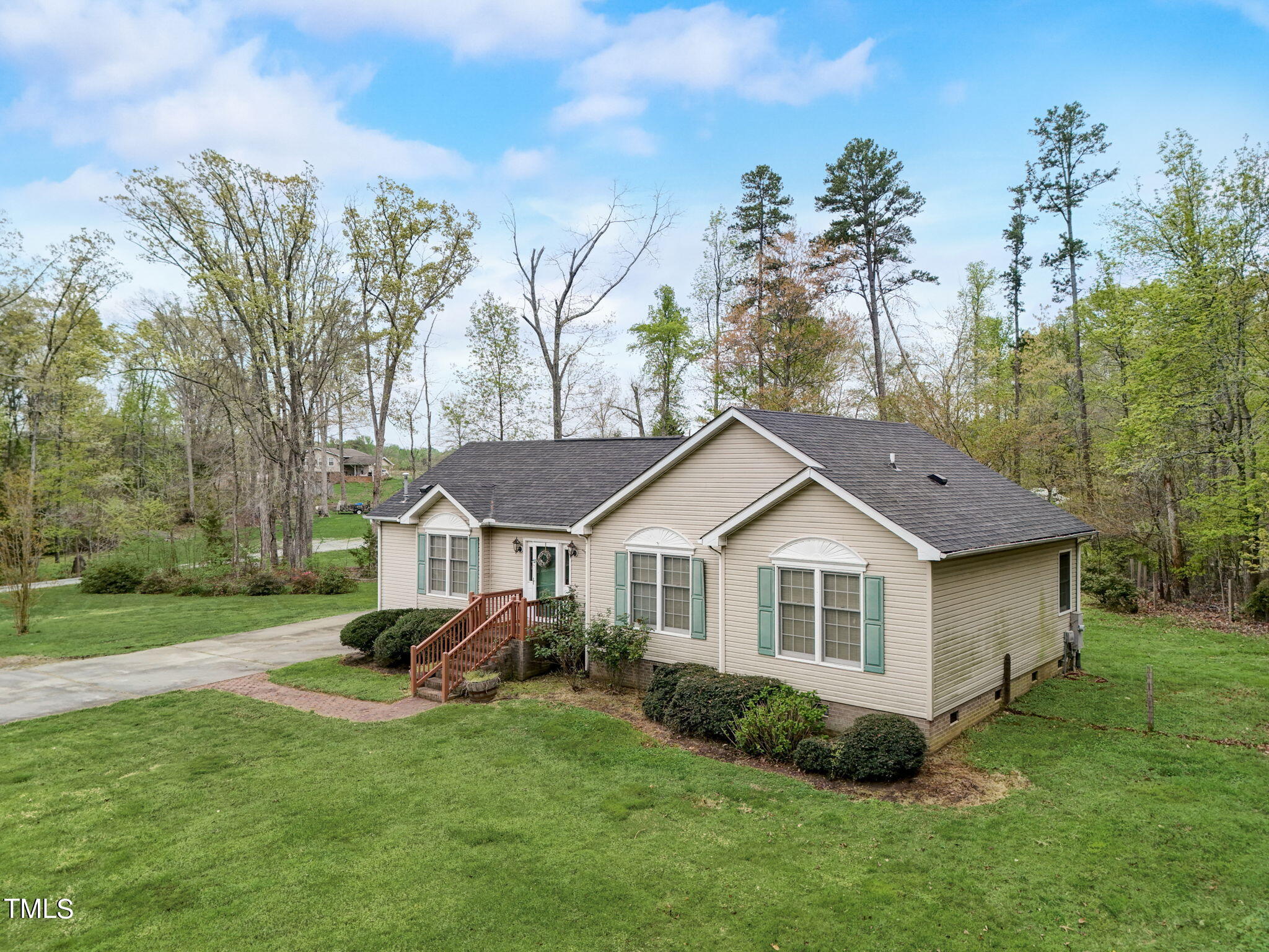 193 Lily Lane Road Roxboro, NC 27574 - Photo 39 of 45 a front view of a house with a garden and trees