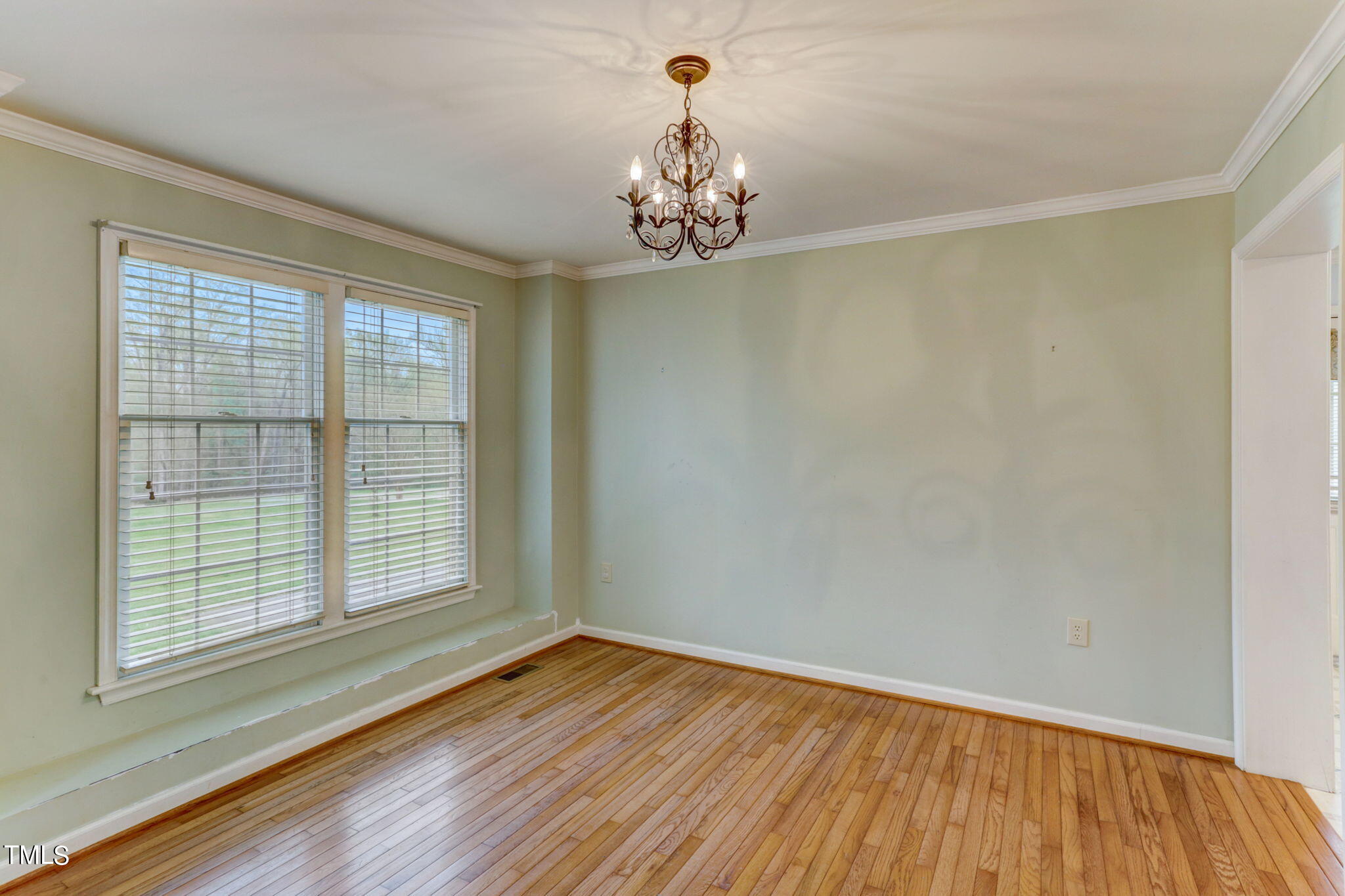 193 Lily Lane Road Roxboro, NC 27574 - Photo 9 of 45 a view of empty room with wooden floor and fan