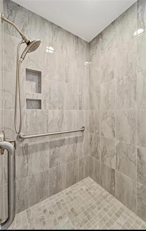 10024 Heather Lane, Unit 1001 Naples, FL 34119 - Photo 12 of 23 a bathroom with a shower