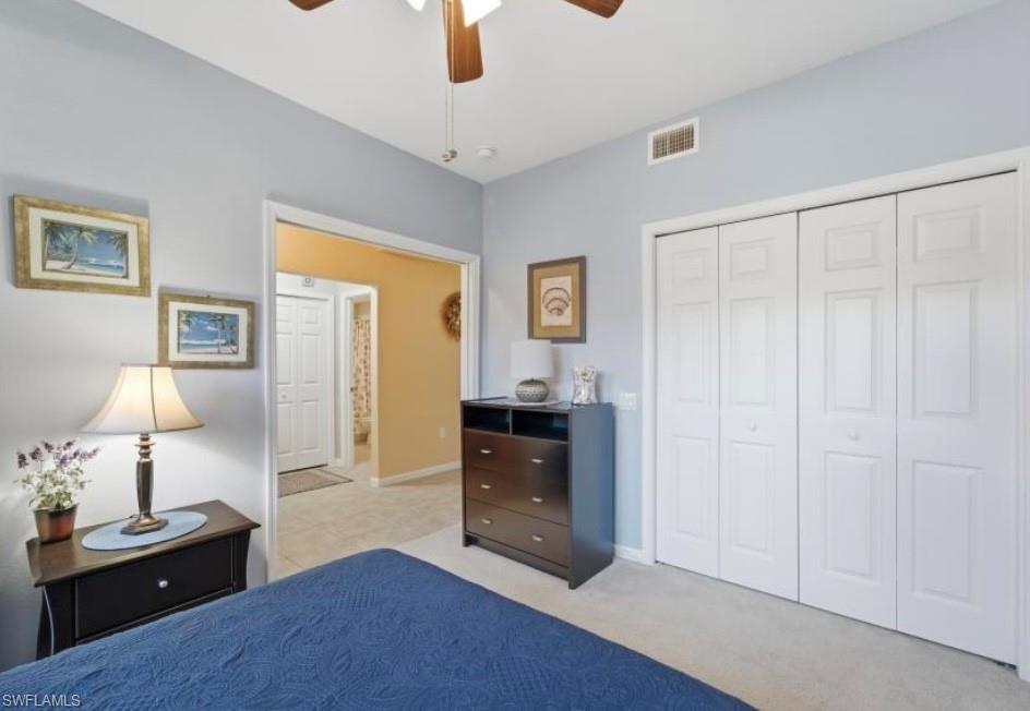 10024 Heather Lane, Unit 1001 Naples, FL 34119 - Photo 19 of 23 a living room with furniture and a window