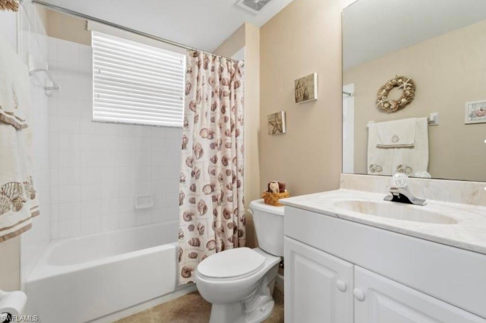 10024 Heather Lane, Unit 1001 Naples, FL 34119 - Photo 20 of 23 a bathroom with a sink toilet and shower