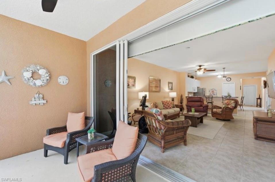10024 Heather Lane, Unit 1001 Naples, FL 34119 - Photo 6 of 23 a living room with furniture