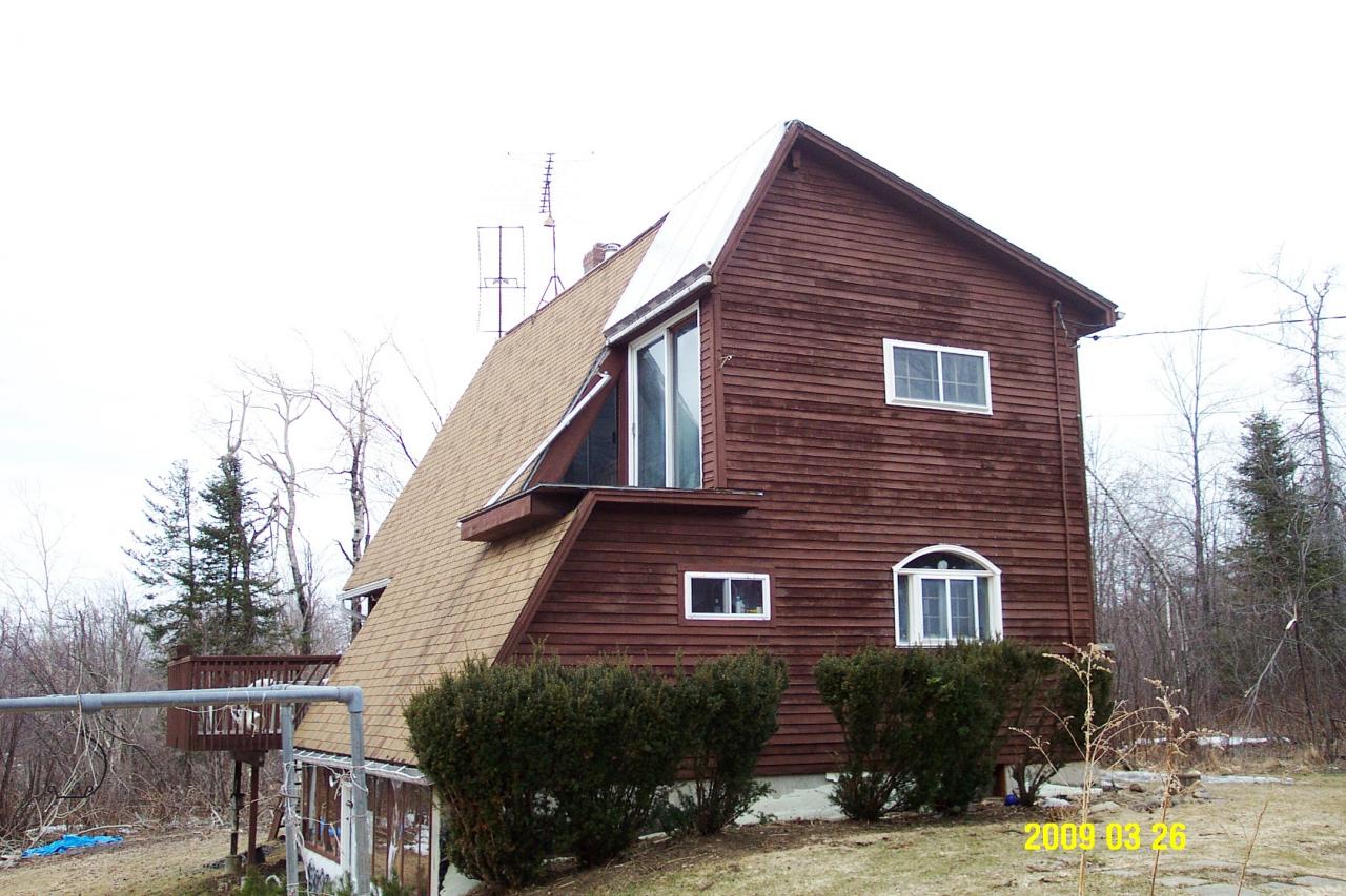 230 East Windsor Road Peru, MA 01235 - Photo 1 of 9 a front view of a house with a yard and potted plants