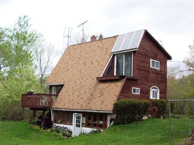 230 East Windsor Road Peru, MA 01235 - Photo 3 of 9 a front view of a house with garden
