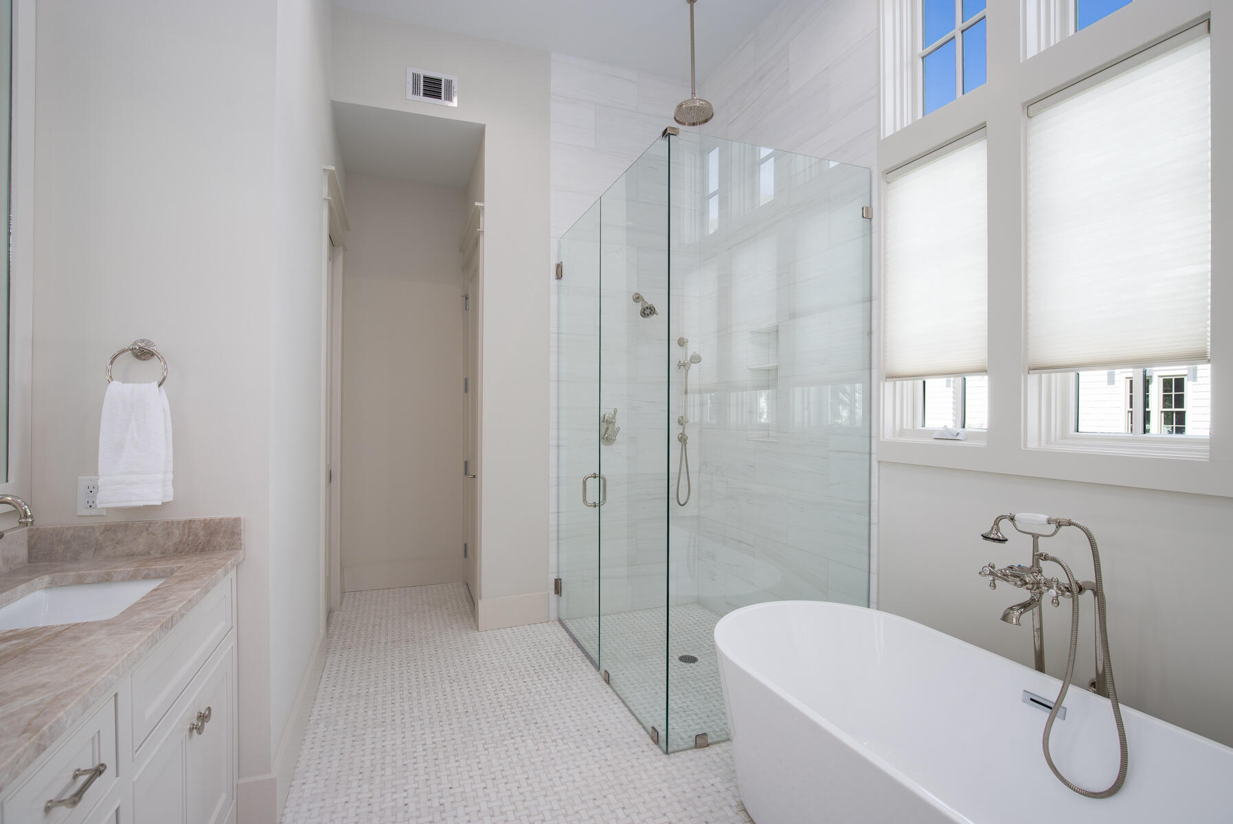 10 Rainer Lane Watersound, FL 32461 - Photo 17 of 30 a bathroom with a granite countertop sink a toilet and shower