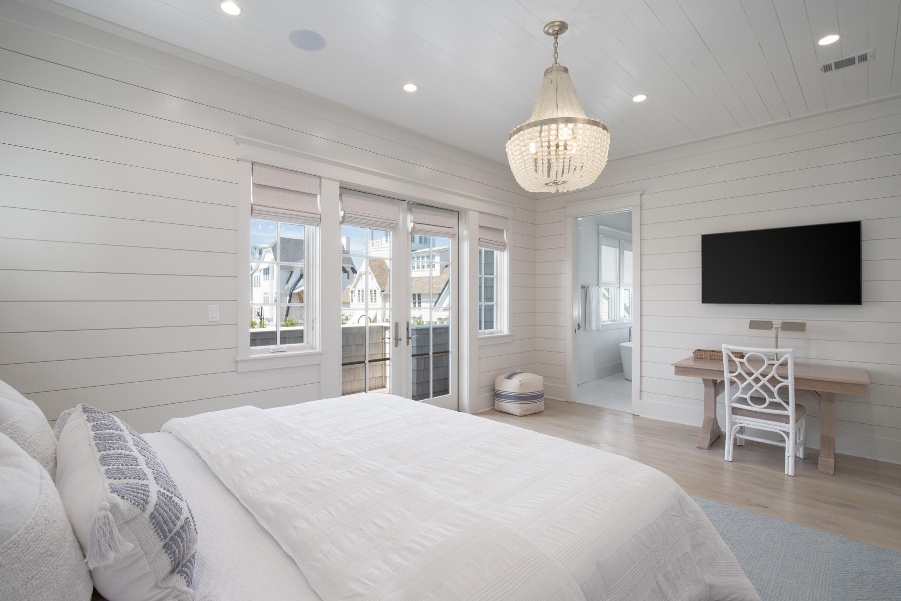 10 Rainer Lane Watersound, FL 32461 - Photo 18 of 30 a bedroom with a bed and a flat screen tv