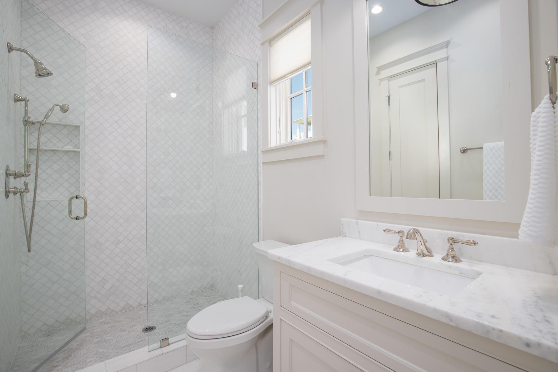 10 Rainer Lane Watersound, FL 32461 - Photo 22 of 30 a bathroom with a granite countertop sink a toilet and shower