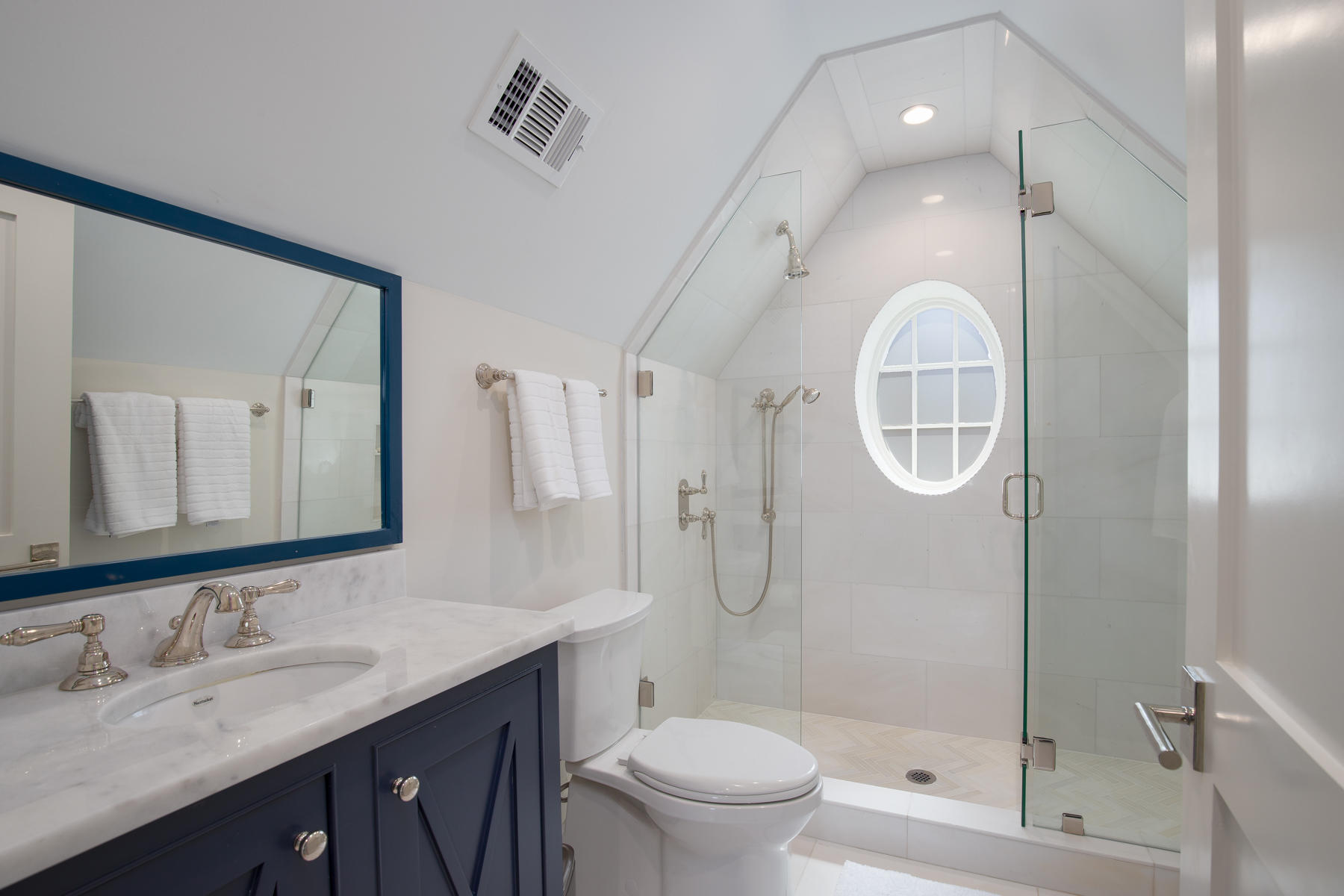 10 Rainer Lane Watersound, FL 32461 - Photo 27 of 30 a bathroom with a double vanity sink toilet mirror and shower