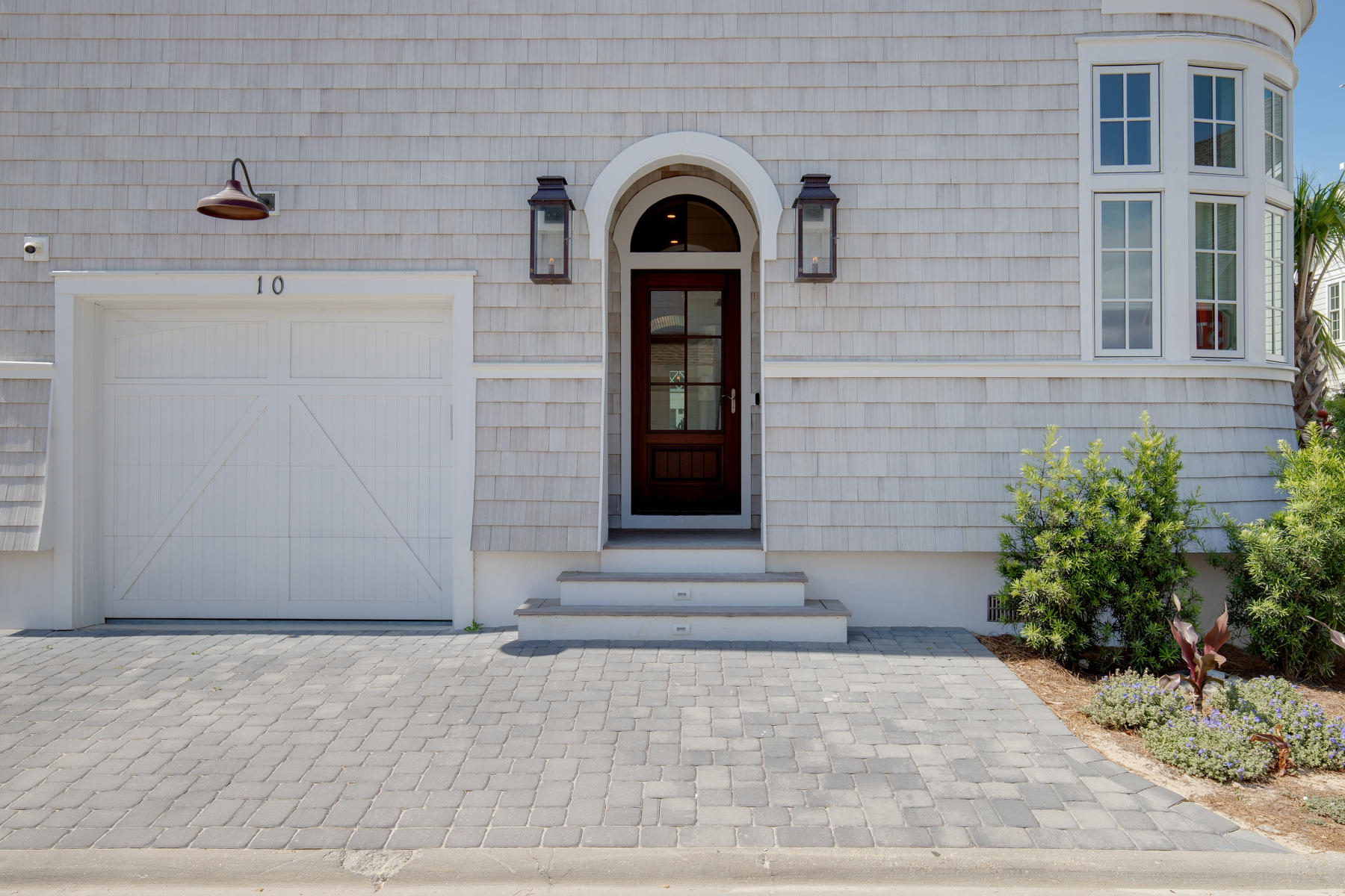 10 Rainer Lane Watersound, FL 32461 - Photo 3 of 30 a view of a brick house with potted plants