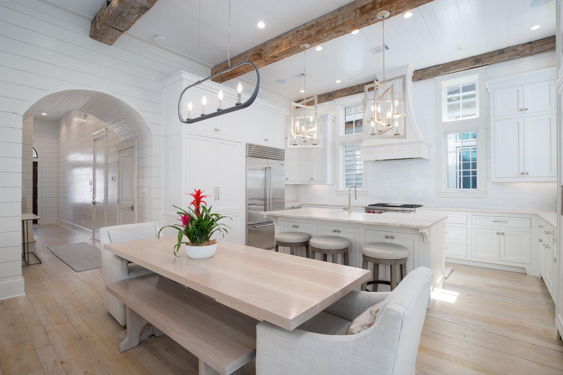 10 Rainer Lane Watersound, FL 32461 - Photo 8 of 30 a kitchen with a table chairs and white cabinets