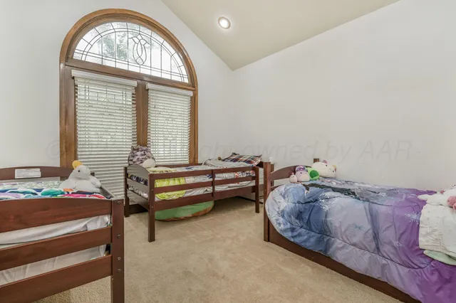 a bedroom with furniture and a window