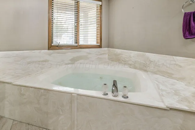 a view of a bathtub in a bathroom