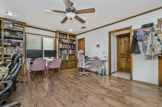a living room with furniture a rug and a window
