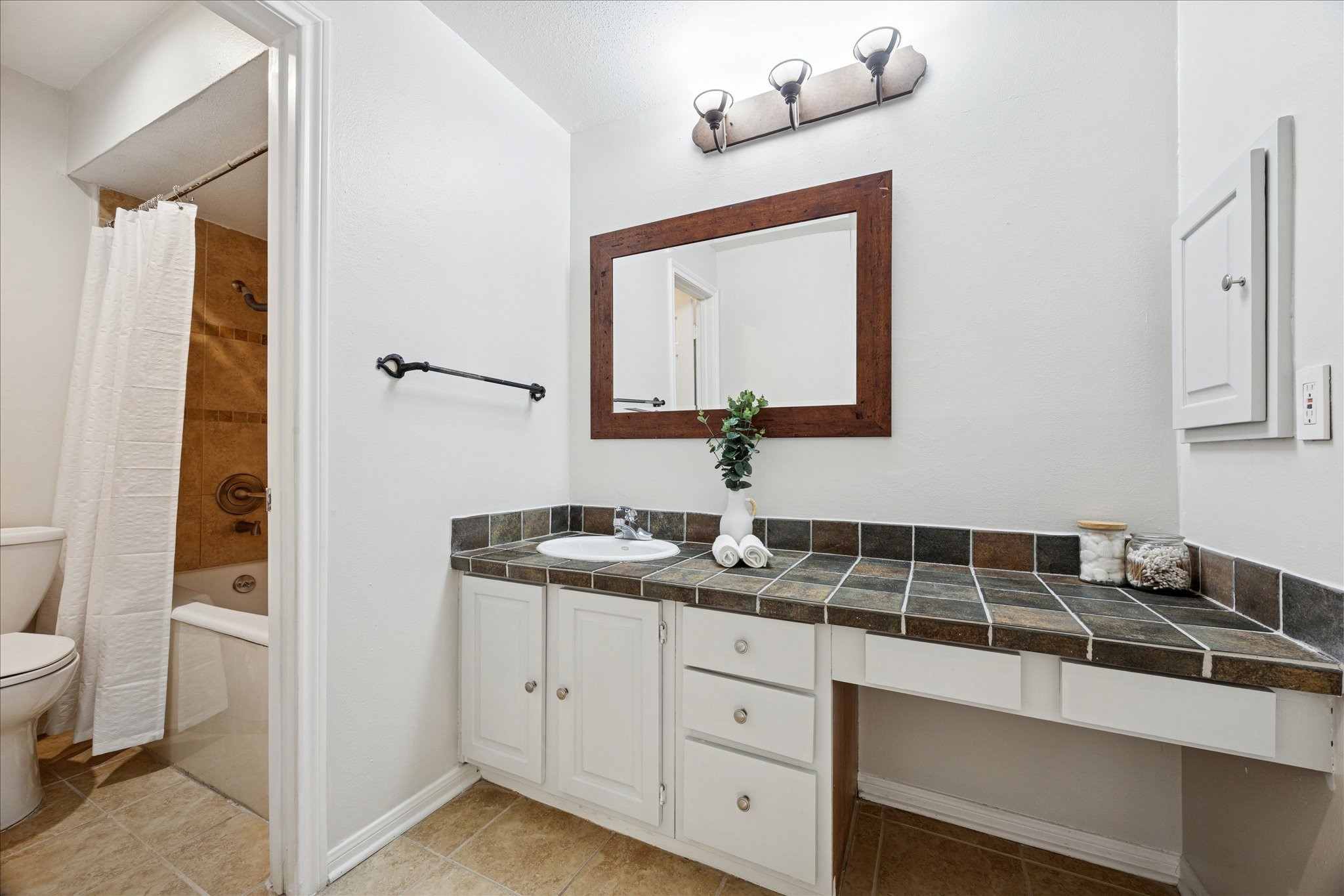 5200 Weslayan Street, Unit 302 Houston, TX 77005 - Photo 14 of 15 a bathroom with a granite countertop sink and a mirror