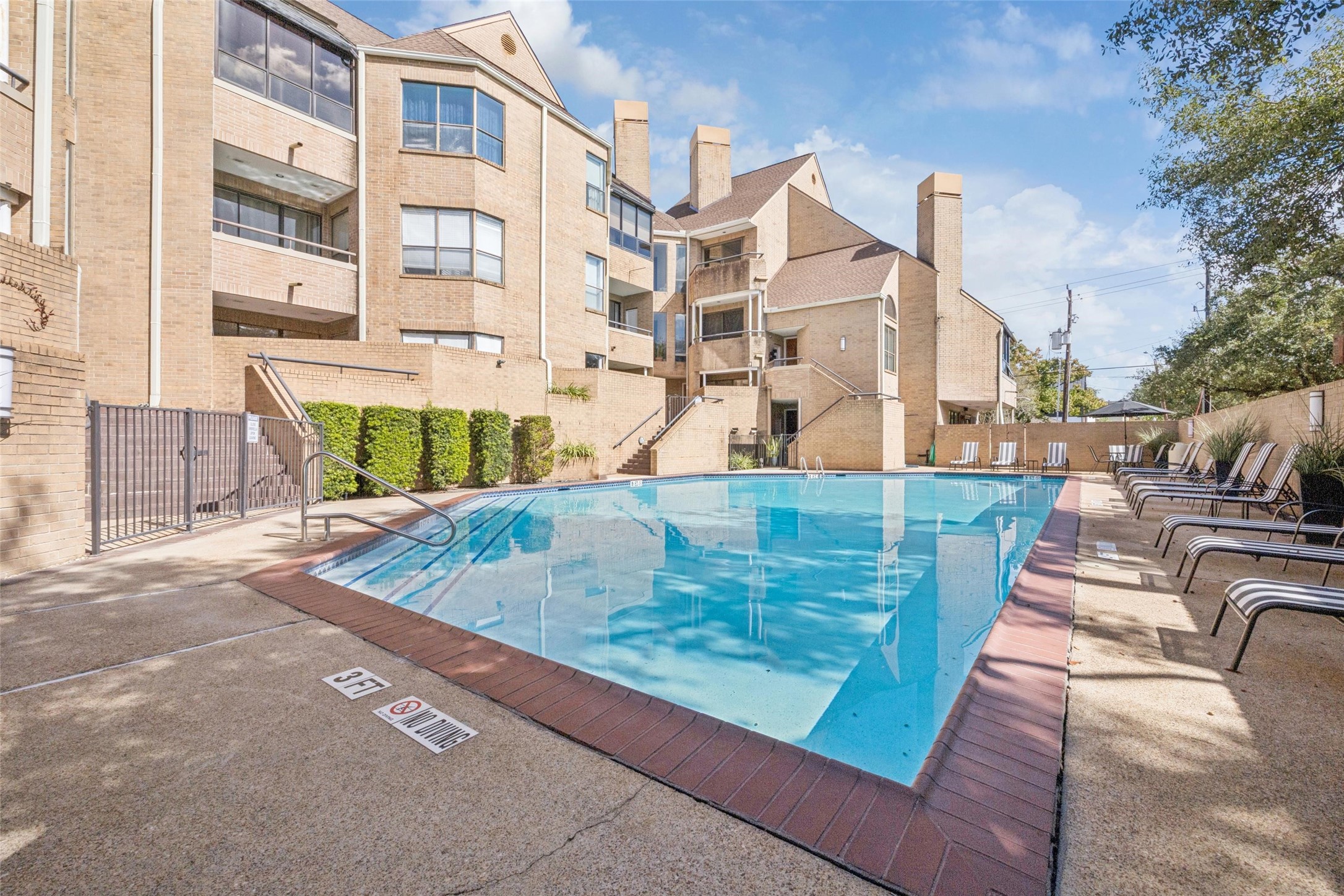 5200 Weslayan Street, Unit 302 Houston, TX 77005 - Photo 15 of 15 a view of a swimming pool with a patio