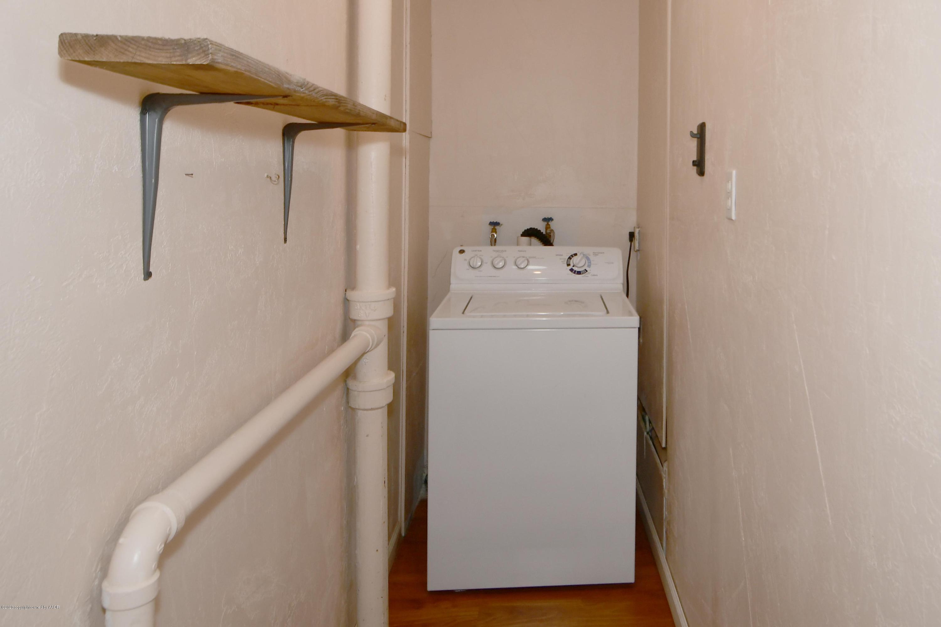 5204 South Travis Street Amarillo, TX 79110 - Photo 17 of 25 a utility room with dryer and washer