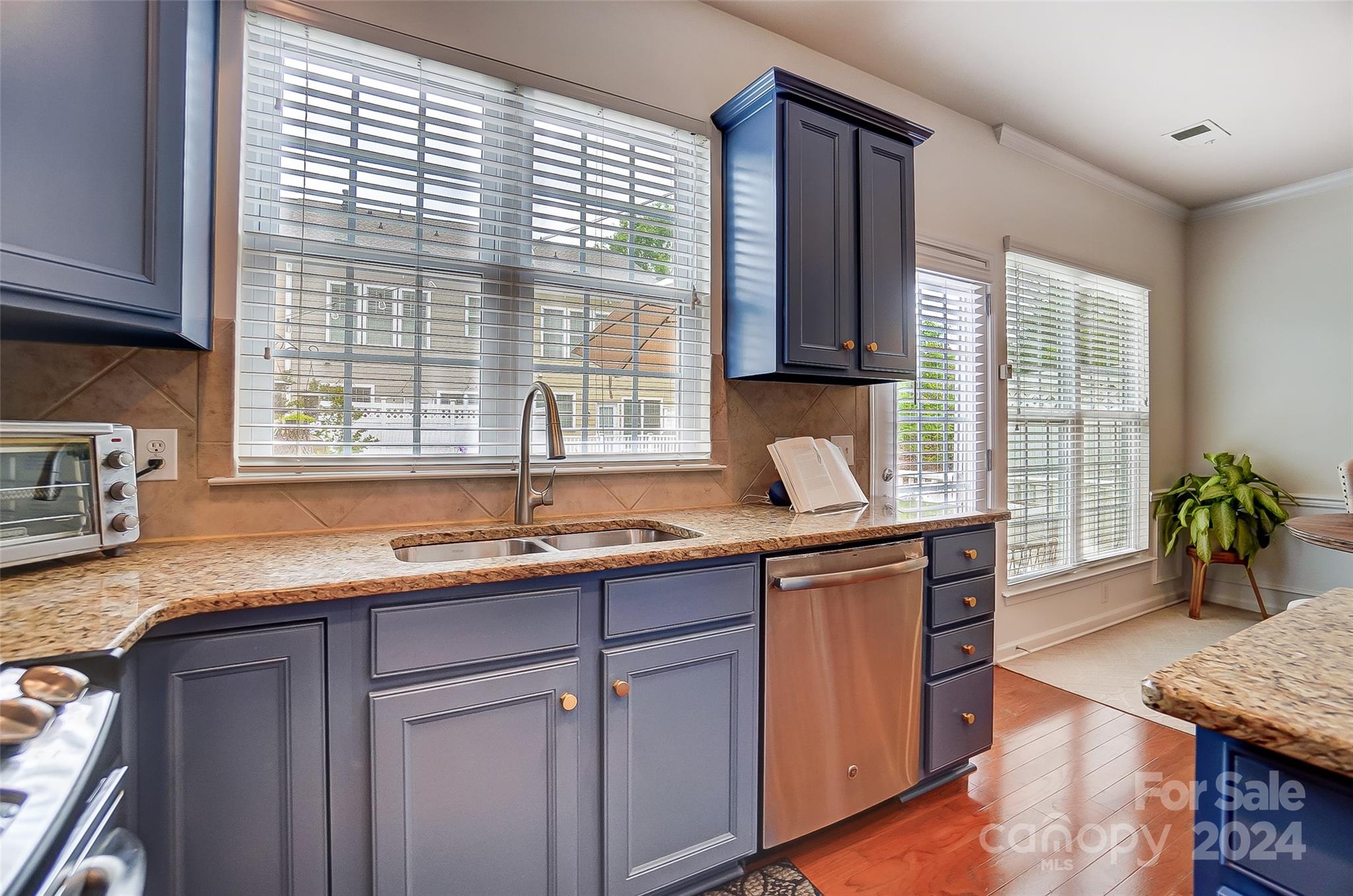 825 Granby Drive Fort Mill, SC 29708 - Photo 14 of 38 a kitchen with granite countertop a sink and a window
