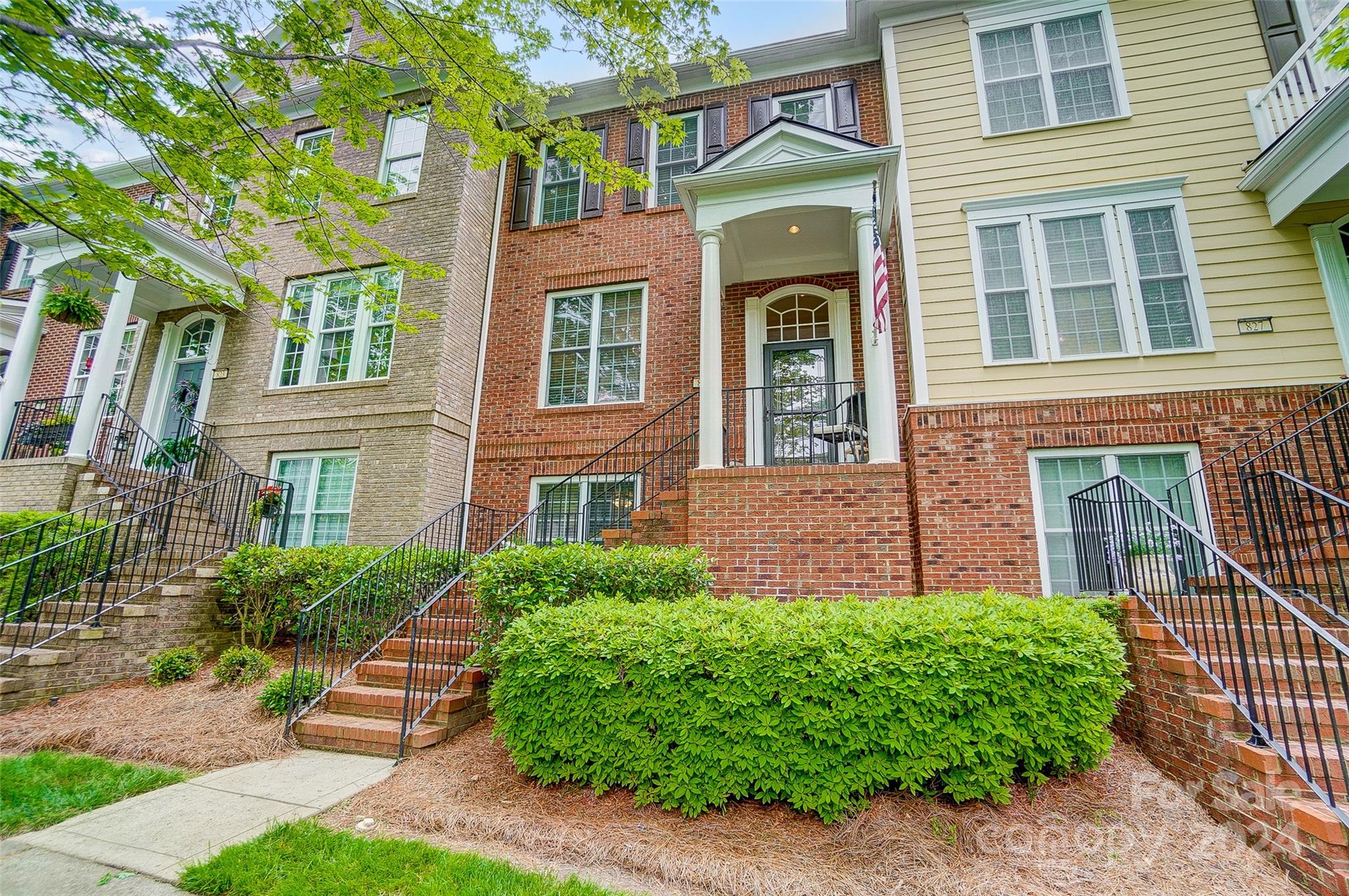 825 Granby Drive Fort Mill, SC 29708 - Photo 2 of 38 a front view of a house with garden