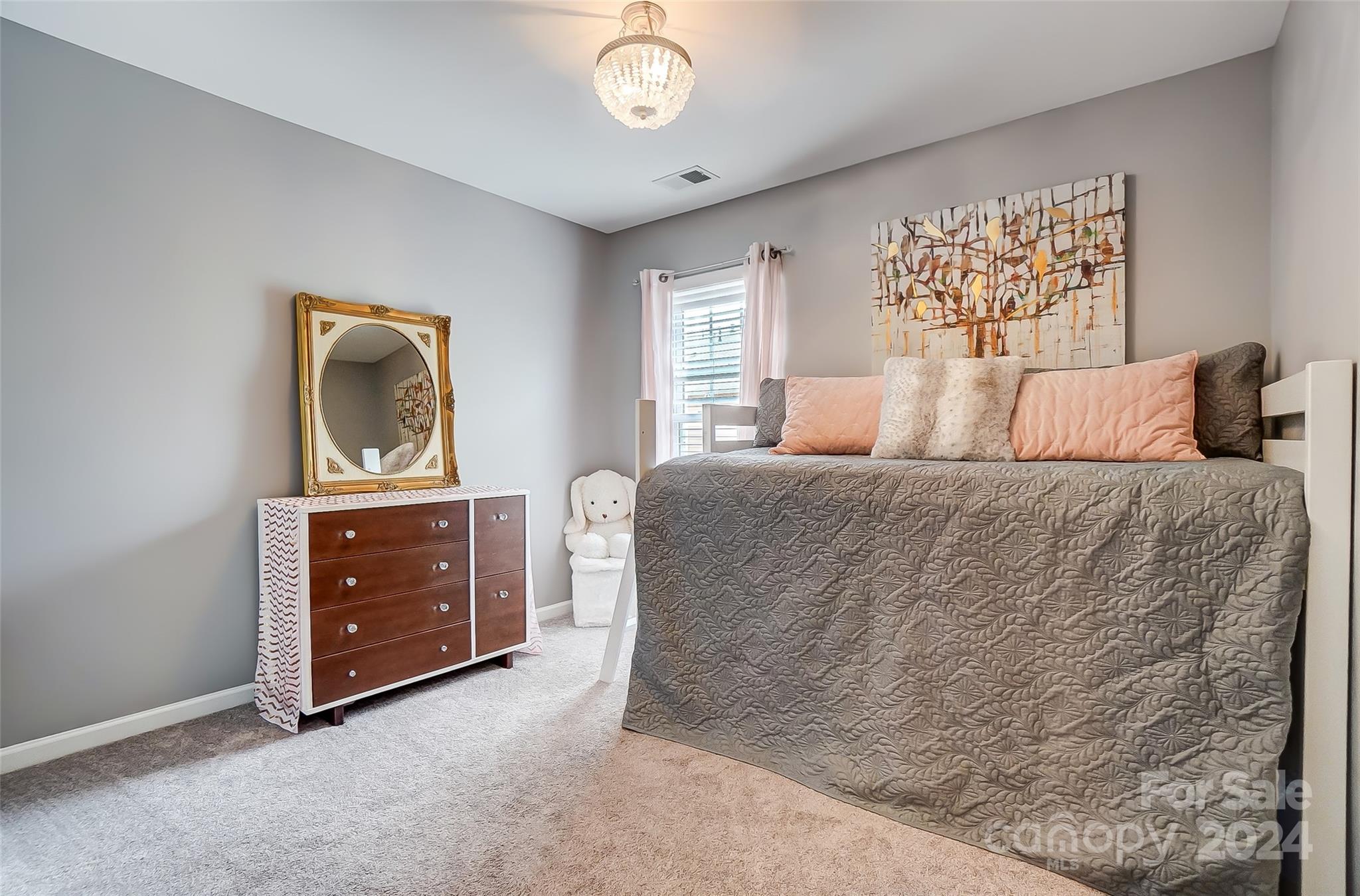 825 Granby Drive Fort Mill, SC 29708 - Photo 25 of 38 a bedroom with a bed and a dresser