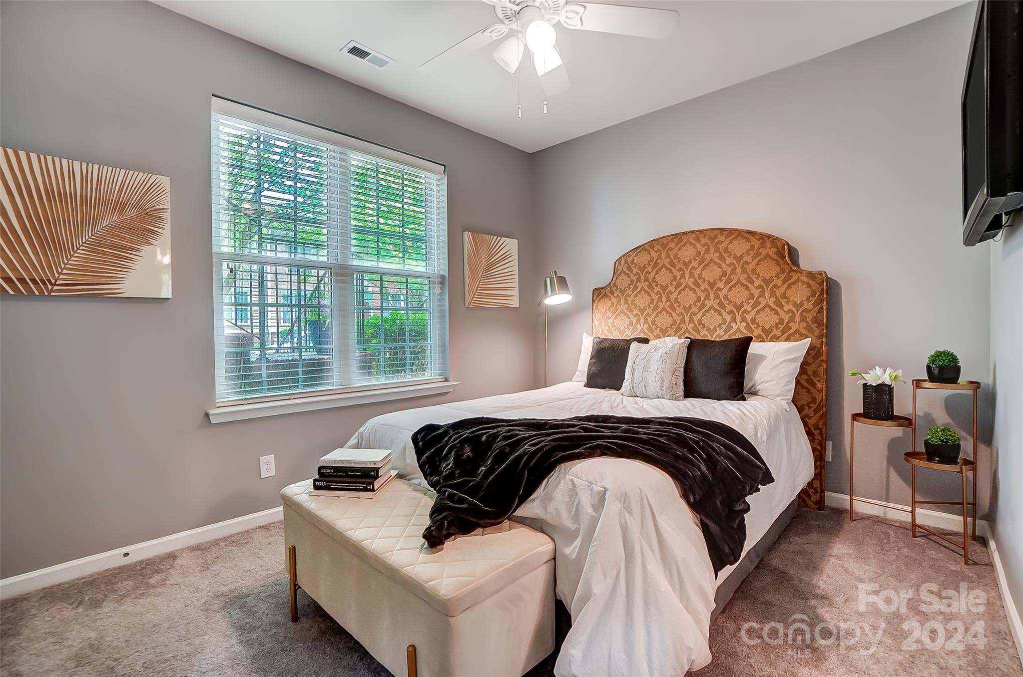 825 Granby Drive Fort Mill, SC 29708 - Photo 30 of 38 a bed sitting in a bedroom next to a window