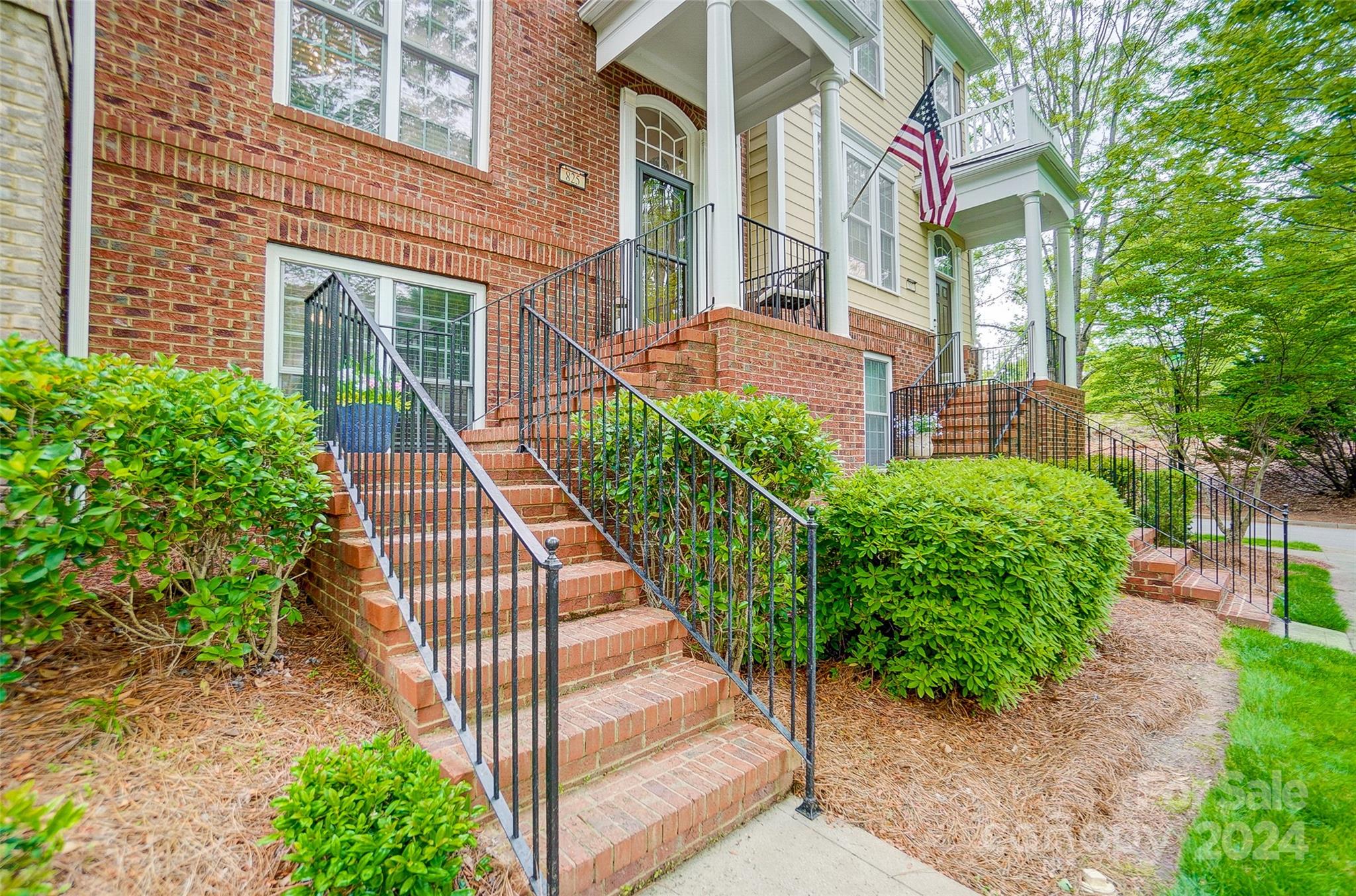 825 Granby Drive Fort Mill, SC 29708 - Photo 3 of 38 a view of a pathway of a house with potted plants
