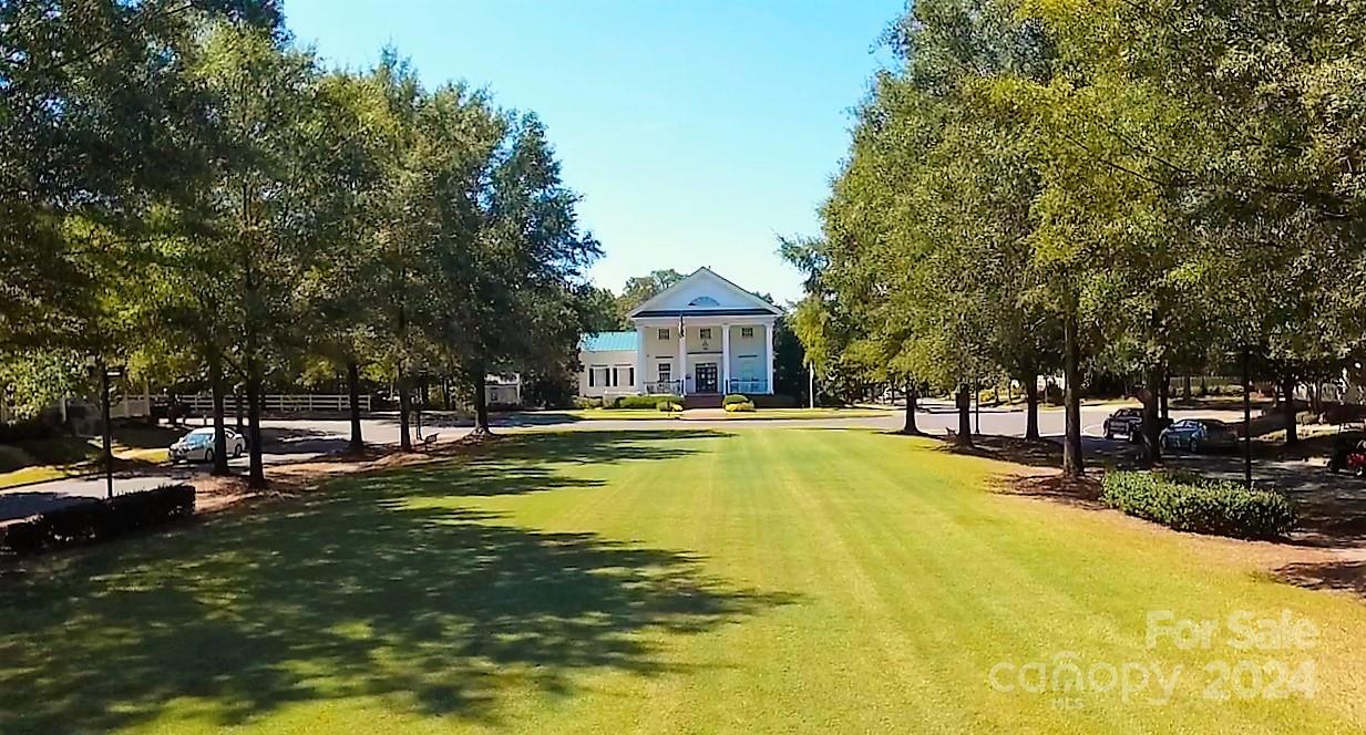 825 Granby Drive Fort Mill, SC 29708 - Photo 36 of 38 a view of a swimming pool with plants and trees