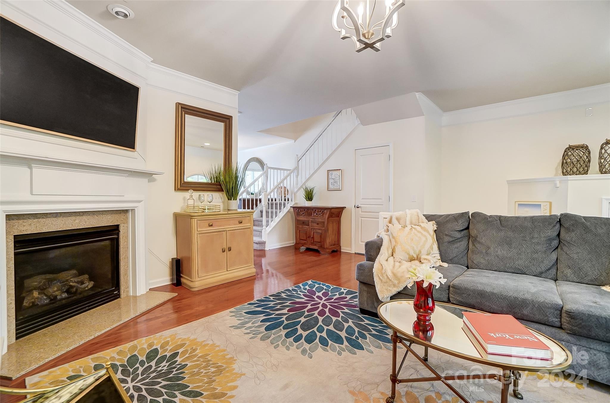 825 Granby Drive Fort Mill, SC 29708 - Photo 8 of 38 a living room with furniture a flat screen tv and a fireplace