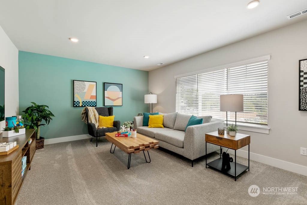 2021 228th Place Southwest, Unit EP 4 Bothell, WA 98021 - Photo 25 of 25 a living room with furniture and a window