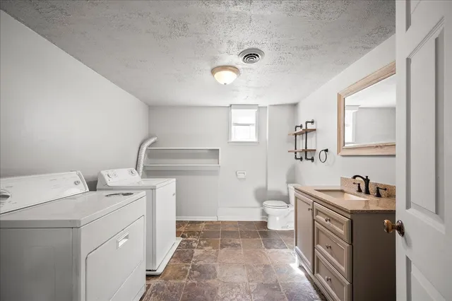 a view of a livingroom with furniture window and wooden floor