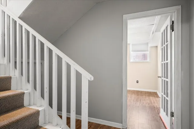 a view of a room with wooden floor