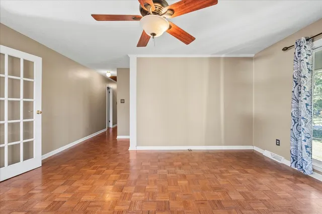 a view of an empty room with a window
