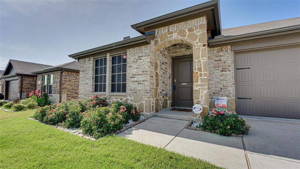 938 Corbitt Lane Fate, TX 75189 - Photo 16 of 16 a front view of a house with a yard