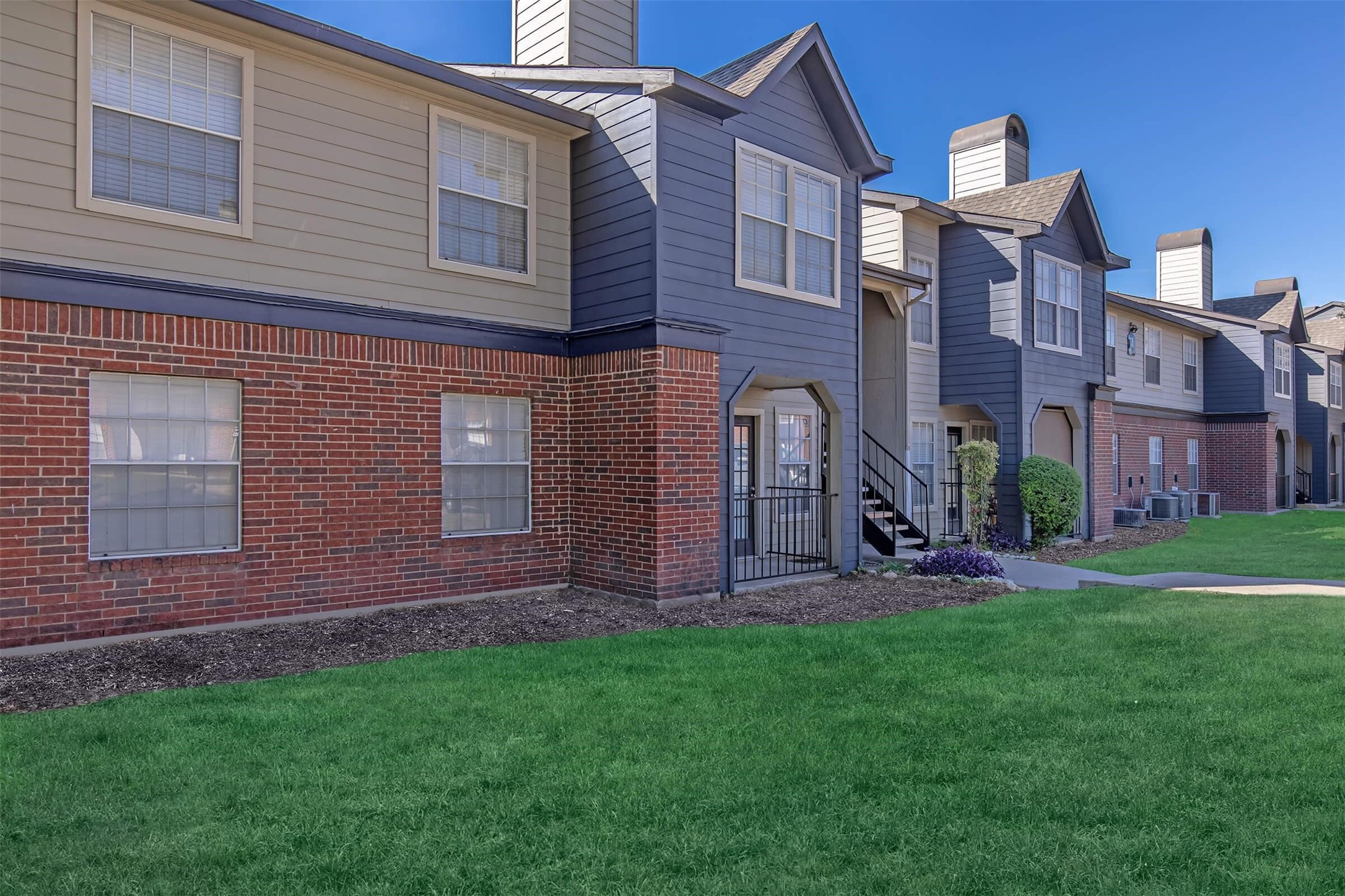 8301 Boat Club Road, Unit 312 Fort Worth, TX 76179 - Photo 37 of 44 a front view of a house with garden