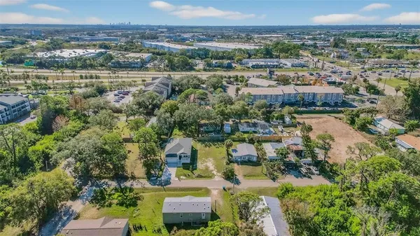 an aerial view of a house with a lake view