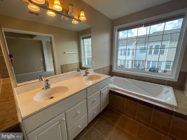 a bathroom with a sink and a bathtub