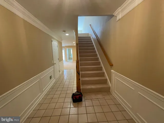 a view of an empty room with windows