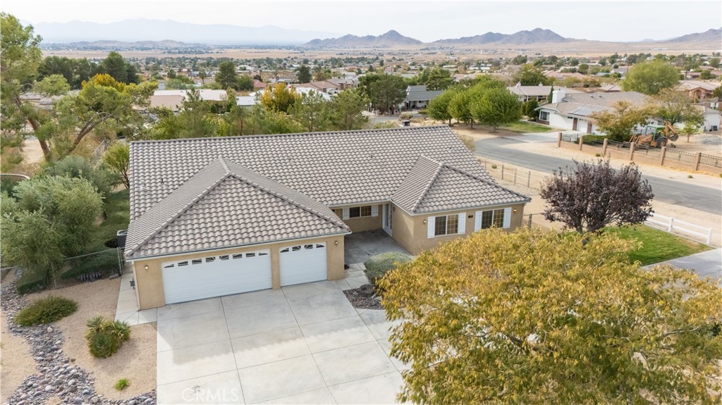 17044 Tiama Road Apple Valley, CA 92307 - Photo 1 of 1 an aerial view of a house with a yard and plants