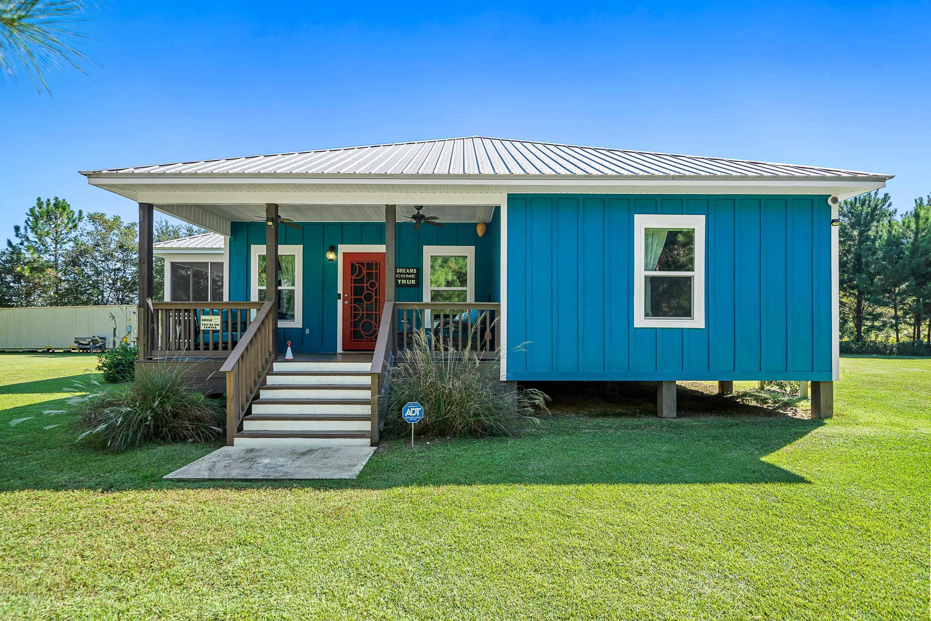 24616 Bretz Lane Elberta, AL 36530 - Photo 11 of 42 Certified FORTIFIED Silver Home (IBHS 2025) with relaxing covered front porch.