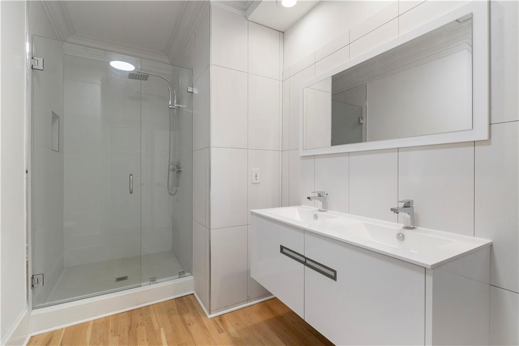 8965 Laurel Way Alpharetta, GA 30022 - Photo 24 of 79 a bathroom with a sink and a mirror