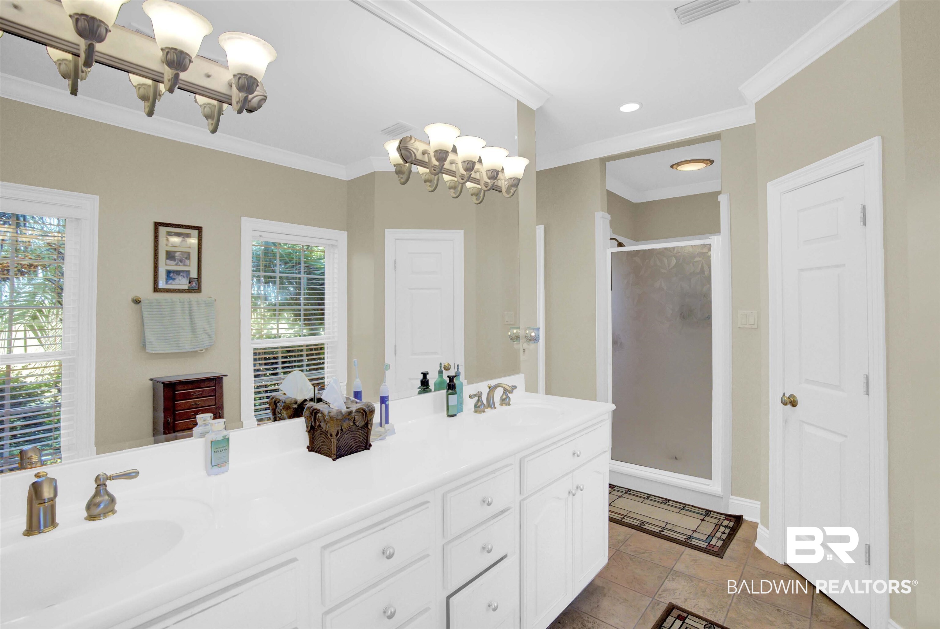 27688 Rigsby Road Daphne, AL 36526 - Photo 29 of 56 Bathroom featuring a shower with shower door, ornamental molding, double vanity, and tile patterned floors