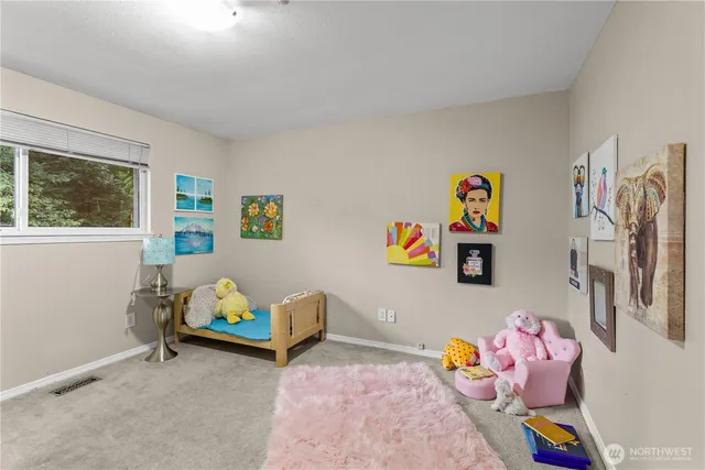 a bedroom with toys and a wooden floor