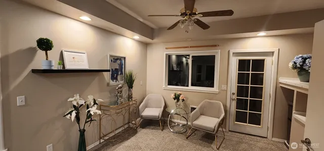 a view of a livingroom with furniture and windows