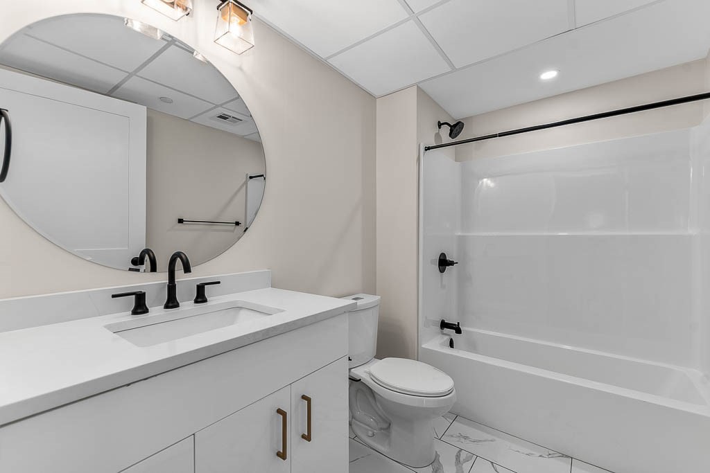 22 Everett Street, Unit 424 Westwood, MA 02090 - Photo 11 of 30 a bathroom with a sink a toilet and shower