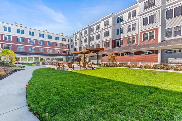 a building view with outdoor seating