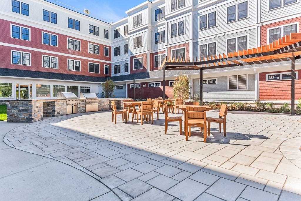 22 Everett Street, Unit 424 Westwood, MA 02090 - Photo 20 of 30 a building view with outdoor seating