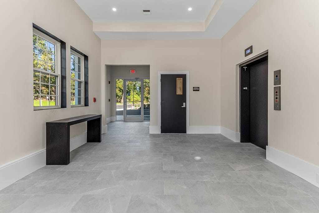 22 Everett Street, Unit 424 Westwood, MA 02090 - Photo 28 of 30 wooden floor in an empty room with a window